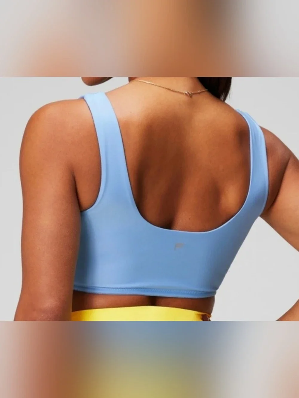 Fabletics Light Blue and Yellow Reversible Sports Bralette. Size XS